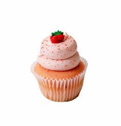 a cupcake with white frosting and red sprinkles is shown on a white background