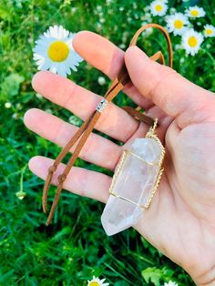 "RAW QUARTZ CRYSTAL NECKLACE ON VEGAN LEATHER CORDING. Quartz crystal is considered the \"master healer\" and is known for its metaphysical properties. It has a very high vibration and amplifies and stores energy while also protects against negativity. It is used to open and align all of the chakras. *STONES VARY some are loner and thinner nda some are shorter and wider. I you have a preference write in note to seller. Choose your size crystal and color of cord. Every stone will be chosen random Spiritual Quartz Crystal Necklace, Adjustable Quartz Crystal Necklace Spiritual, Adjustable Quartz Crystal Spiritual Necklace, Adjustable Bohemian Quartz Necklace, Adjustable Quartz Crystal Necklace For Spiritual Use, Adjustable Quartz Bohemian Necklace, Minimalist Adjustable Wire Wrapped Crystal Necklaces, Adjustable Quartz Crystal Necklace For Healing, Bohemian Hand Wrapped Quartz Jewelry