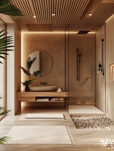 a bathroom with a sink, mirror and plants in the shower area is lit by recessed lighting