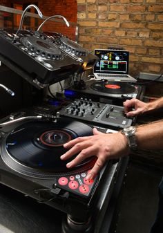 a man is playing music on his turntable