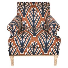 a brown and blue patterned chair with wooden legs