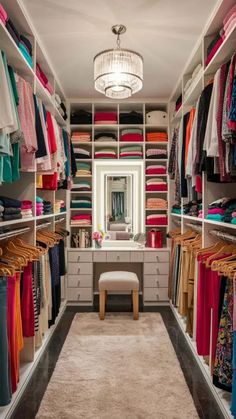 a walk in closet filled with lots of clothes