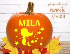 a pumpkin with the word'mia'painted on it and fall leaves around it