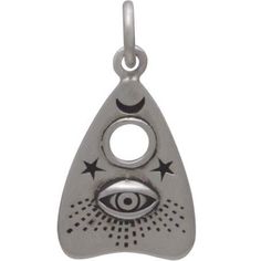 Those fascinated with the occult will be delighted by this sterling silver Ouija planchette charm with all-seeing eye. It features details you might find on the real thing, like tiny stars & moon, the hole for selecting letters, and an all-seeing eye. The Ouija board launched in the 1800s at a time when Americans were obsessed with communicating with loved ones who had passed. Seances were common then, complete with rapping walls and turning tables. Enter the Ouija board. This simple device made Handmade Sterling Silver Symbolic Charms, Handmade Symbolic Sterling Silver Charms, Silver Symbolic Good Luck Charms, Silver Good Luck Symbolic Charms, Nickel-free Sterling Silver Spiritual Charms, Sterling Silver Engraved Spiritual Charms, Symbolic Eye-shaped Silver Jewelry, Palm Tree Necklace, Ouija Planchette