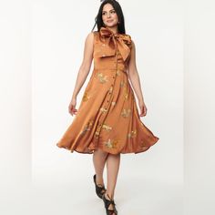 This Darling Dress Is Crafted In A Lightweight Woven Fabric That Gleams In A Gorgeous Rust Brown And Boasts Leopard Cats Printed Throughout. The Button Up Front Leads To A Marvelous Self Tie Bow Collar, Framed By The Sleeveless Silhouette. The Subtle Swing Skirt Drops From The Seamed Waist And Dances Around Your Knees, Complete With Side Pockets! Imported 100% Polyester Hand Wash, Hang Dry Unlined, Button Up Front Attached Self Tie Collar Side Pockets Material Has No Stretch Uv Clothing, Unique Vintage Dresses, Leopard Cat, Tie Collar, Crazy Outfits, Vintage Inspired Fashion, Bow Collar, Darling Dress, Tie Bow