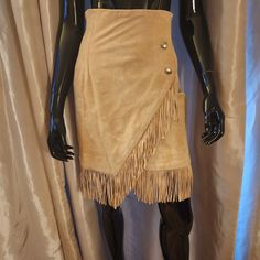 "This vintage Western Suede Fringe Camel Skirt is the perfect add to any wardrode.  It's created in a faux wrap style with silver color button that are just for detail as well.  This pre-owned item comes in great condition.  The sizing says 4, but please go by measurements. Measured laying flat no stretch 12\" Waist 15\" Hip 23.5\" Length Note skirt is unlined" Vintage Beige Party Skirt, Vintage Brown Skirt For Party, Cowgirl Skirt, Camel Skirts, Suede Fringe Skirt, Western Vintage, Fringe Skirt, Suede Fringe, Camel Color