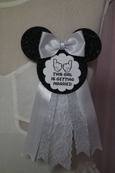 this girl has married mickey mouse badge on it