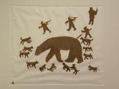 a brown bear surrounded by black bears on a white wall