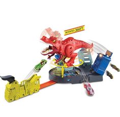 a toy dinosaur plays with his toys