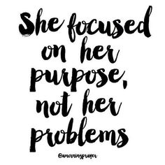 a black and white quote with the words she focused on her purpose, not her problems