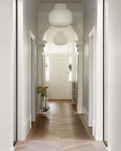 the hallway is clean and ready to be used as an entrance way for someone's home