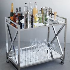 a bar cart filled with bottles and glasses