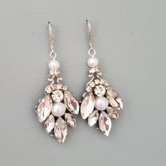 Beautiful bridal victorian style chandelier earrings ,made with top quality swarovski crystals. Pear shape drop crystal suspended from a crystal covered french hooks. Vintage Wedding Earrings With French Hook, Vintage French Hook Earrings For Wedding, Elegant Jeweled Teardrop Dangle Earrings, Jeweled Dangle Earrings For Anniversary, Jeweled Dangle Bridal Earrings, Jeweled Crystal Dangle Bridal Earrings, French Hook Dangle Wedding Jewelry, Ornate Jeweled Earrings For Wedding, French Hook Dangle Jewelry For Wedding