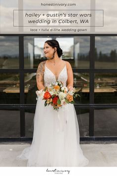 a woman standing in front of a building holding a bouquet