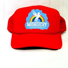 a red trucker hat with the words monkeyy on it and a rainbow in the background