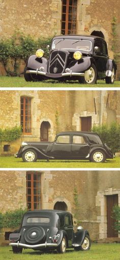 an old black car parked in front of a stone building with two doors and windows