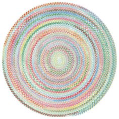 a multicolored circular rug on a white background