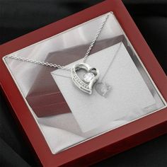 Give a loving gift that will make her heart melt! This dazzling Forever Love Necklace features a polished heart pendant surrounding a flawless 6.5mm cubic zirconia, embellished with smaller crystals adding extra sparkle and shine. The pendant is crafted in 14K white gold finish and dangles from an adjustable cable chain secured with a lobster clasp. DIMENSIONS: ▶ 14K white gold finish ▶ Adjustable cable chain 18" - 22" ▶ 6.5mm round cut cubic zirconia ▶ Height 0.8" (2.2cm) Width 0.7" (1.8cm) PERFECT FOR: Birthday Gift, Thanksgiving Day Gift, Christmas Gift, New Years Gift, Best Friend Gift, Family Gift, Valentines Day Gift, Mother Necklace, Daughter Necklace, Promise Necklace, Daily-wear Necklace. Dazzling Heart-shaped Jewelry For Gifts, Dazzling Heart Shaped Jewelry For Gifts, Dazzling Heart-shaped Jewelry Gift, Elegant Heart Necklace With Sparkling Stones For Gift, Heart Pendant Jewelry With Sparkling Stones For Gifts, Gift Heart Pendant Jewelry With Sparkling Stones, Heart-shaped Jewelry With Sparkling Stones For Gifts, Crystal Heart Necklace For Valentine's Day Anniversary, Valentine's Day Necklaces With Sparkling Stones As Gifts