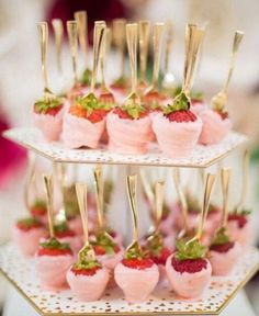 small desserts with strawberries and gold forks