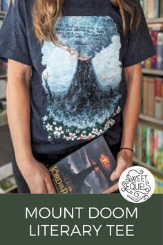 a woman holding a book in front of bookshelves with the words mount room library on it