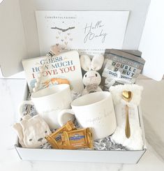 a gift box filled with coffee, books and other items for someone's special occasion