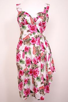 Exclusive to Doghouse Vintage,1940/ 50 s style Hawaiian dress. Taken from an original Vintage American pattern,made up in a quality stretch fabric,in vibrant colours,which enhance the styling and look of this dress. Shoulder straps,cross over at the back if preferred,elastic panels at each side to ensure comfort and a perfect fit. Full back zip,finished with hook and eye. The dress is cut and styled with all you curvy ladies in mind. Beautifully draped from the waist. This Mid-Century 1940/50s H Cheap Retro Vacation Dresses, Cheap Party Dress With Tropical Print, Cheap Tropical Print Party Dress, Cheap Hawaiian Summer Dress, Old Havana Nights Womens Dresses, Cheap Tropical Party Dresses, Army Ball - Luau Dress, 1950s Style Summer Dresses With Retro Print, Vintage 1950s Dresses Parties