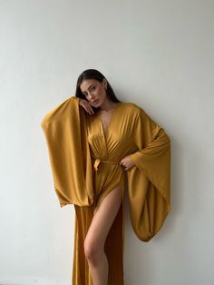 Kimono sleeves long robe - tie waist - open front - kimono sleeves - two side slits Sizes: Regular size - hips to 107 cm (42 inch) Plus size - hips more than 107 cm (42 inch) Fabric - 30% viscose, 70% polyester Your order is packed in an eco-pack of 100% cotton. This bag is convenient for storing and washing our product Shipping terms: Delivery to Europe - 1-2 weeks Delivery to USA, UK 1-3 weeks Australia, Canada - 2-4 weeks Returns & exchanges 1. Confirmation Period: We confirm exchanges and re Deep Plunge Robe, Long Kimono For Bridesmaids, Fitted Wrap Robe, Elegant V-neck Party Kimono, Elegant Maxi Dress With Tie Waist And Kimono Sleeves, Elegant Open Front Kimono With Tie Waist, Elegant Wrap Dress With Kimono Sleeves For Beach, Open Front Robe For Spring Party, Spring Party Robe With Open Front