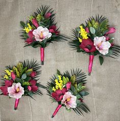 four bouquets of flowers are arranged on a table cloth with green leaves and pink orchids