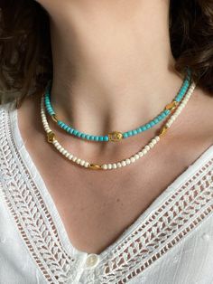 NIREAS NECKLACE Charoite beads chocker necklace with gold plated fish details (Off-White / turquoise) Dimensions: Total necklace length  38cm / 14.9 in + 5cm / 1.96in  extender chain Weight: 15gr DELIVERY (estimate delays) Greece: 2-5 business days via ELTA  Europe: 5-10 business days via Hellenic Post International: 10-21 business days via Hellenic Post You can shorten considerably your delivery times by upgrading to DHL Express services at checkout.  All PURE GREEK Jewels  are inspired from th Gold Turquoise Necklace With Colorful Beads As Gift, Beach Turquoise Necklace With Round Beads, Turquoise Strand Beaded Necklace As Gift, Turquoise Strand Beaded Necklace For Gift, Turquoise Choker Necklace As A Gift, Gold Single Strand Turquoise Necklace For Gift, Gold Round Beads Choker For Summer, Gold Choker With Round Beads For Summer, Gold Single Strand Beaded Necklace For Beach