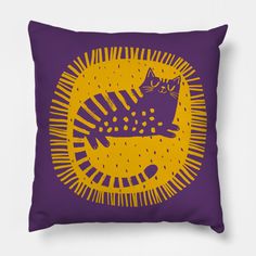 a purple and yellow pillow with a cat on it