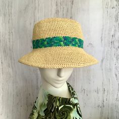 Raffia bucket hat  Straw summer hat with a bright stripe in shades of green.  Crocheted from 100% natural raffia pulp. Hats made of this natural material perfectly pass moisture, do not soar and protect from the sun. A hat with a small brim will provide plenty of shade. The perfect hat for summer travel. Very light and breathable.   Please measure your forehead at the widest point or where you would like the hat to be before placing an order.   Recommended care: * Hand wash in cold water without Green Flat Brim Hat For Vacation, Summer Multicolor Cloche Hat With Short Brim, Green Flat Brim Boater Hat For Summer, Green Summer Boater Hat With Flat Brim, Green Brimmed Panama Hat For Spring, Multicolor Cloche Hat With Short Brim For Summer, Green Flat Brim Bucket Hat For Spring, Green Flat Brim Bucket Hat For Vacation, Green Curved Brim Straw Hat For Spring