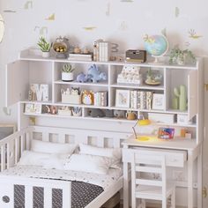 a white bed sitting next to a book shelf filled with books