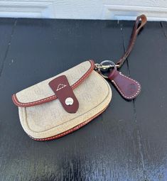 Here we have a beautiful Vintage Clutch from Dooney & Bourke. DB tan Canvas and trimmed in chocolate brown leather. Dooney & Bourke tag inside serial is k6261511. Measures: 6 inches wide, 4 inches high, and 1 inch deep. The strap is 12 inches long. Enjoy Free Shipping on All of my items to the Continental USA. (unless otherwise noted) All my items are Vintage or Antique and keep in mind items are not new. Items have had a life before their soon-to-be new home. All items are hand-picked by the sh Leather Wristlet Dooney & Bourke, Wristlet Pouch, Vintage Clutch, Antique Market, Canvas Leather, Hand Picked, Leather Trim, Dooney Bourke, Monogram Canvas