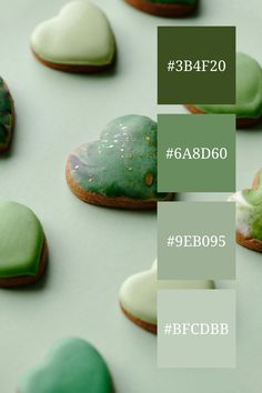 some green and white cookies are arranged on a table with the words becbdbb below them