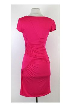 Add a pop of color to your every-day wardrobe with this pink gathered dress. Bodycon fit accentuates your figure and light jersey fabric makes it comfortable and breathable. Size Small Body 95% Rayon 5% Spandex Slips on V neck Shoulder to Hem 36.5" BCBG offers a casual and contemporary style with youthful sophistication. With this brand you will easily transition from work to play. BCBG is a large brand that has everything from wedding to runway. With tons of styles to choose from, you will alwa Pink Stretch Ruched Dress, Pink Stretch Dress With Ruched Bodice, Short Sleeve Stretch Dress With Ruched Sides, Short Sleeve Dress With Ruched Sides And Stretch, Pink Ruched Elastane Dress, Pink Fitted Dress With Ruched Sides, Fitted Pink Dresses With Ruched Sides, Short Sleeve Ruched Elastane Dresses, Casual Ruched Elastane Dress