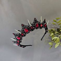 ❤ Beautiful silver red and black crystals bridal crown, gothic tiara for your special day! Spiked crown made of elegant red and black crystals, metal beads and black jewelry wire. ❤ Gothic crown is the perfect wedding hair accessory for the bride. ❤ Perfect for brides and bridesmaids! It is a perfect way to add glamour and sparkles to your wedding updo. ❤ Handmade ❤ You are welcome with custom inquiries Red Crown Jewelry For Wedding, Red Crown Headpiece For Wedding, Gothic Crown Headpiece For Wedding, Red Round Crown For Party, Red Party Crown, Red Crown Headpiece For Parties, Red Crown Headpieces For Party, Black Round Crown Headpieces For Wedding, Black Tall Crown For Party