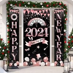 two black doors decorated with pink and white decorations for a new year's eve party