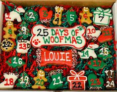 an assortment of decorated cookies in a box with numbers and christmas decorations on it's side