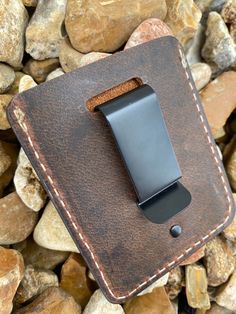 "Every wallet is handmade to order from high-quality buffalo leather. -Minimalist Design -2 front pockets, 1 main pocket -Metal money clip on backside -White stitching -Finished edges -Dimensions: 3.75\" x 3\" Our brown crazy horse buffalo leather is soft and durable and will develop beautiful character over time. This minimalist style wallet is the perfect gift for anyone and is carefully handcrafted by us here in our shop. Feel free to message us with any questions! Minimalist Leather Wallet, Rectangular Trifold Wallet With Belt Clip For Everyday Use, Everyday Use Trifold Wallet With Belt Clip, Brown Wallet With Belt Clip For Everyday Carry, Brown Leather Wallet With Key Clip, Brown Leather Wallet With Flat Pocket, Leather Card Holder For Everyday Carry, Leather Card Holder With Belt Clip For Everyday, Leather Trifold Wallet With Belt Clip For Everyday, Leather Bifold Card Holder With Belt Clip