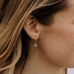 The Carolina Daisy Hoops are dainty floral drop hoops. High quality gold vermeil (gold plated sterling silver). Hypoallergenic and good for sensitive skin. Dainty Hoop Earrings With Flower Charm, Dainty Hypoallergenic Flower Earrings, Delicate Hypoallergenic Flower Earrings For Everyday Wear, Delicate Flower Shaped Hoop Earrings, Delicate Flower-shaped Hoop Earrings, Tiny Minimalist Flower Earrings, Gold Plated Dainty Earrings With Flower Charm, Dainty Gold-plated Flower Charm Earrings, Dainty Gold Plated Earrings With Flower Charm