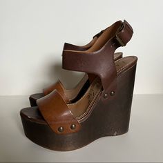 This Is A Pair Of Previously Loved Lanvin Brown Wedges. They Are A Two Tone Brown And I Love Love Love These Shoes But Have Too Many Brown Wedge Styles. There Are Some Signs Of Wear As Shown In Images. Size On Shoe Is: 39 Genuine Leather Made In Italy Brown High Heel Wedge Sandals, Brown Wedge Sandals With Stacked Heel For Beach, Vintage Brown Wedge Heel Sandals, Brown Wedge Sandals With Wooden Heel, Brown High Heel Wedge Sandals With Heel Strap, Brown High-heel Wedge Sandals With Heel Strap, Brown Wedge Sandals With Heel Strap, Vintage Brown Wedge Sandals For The Beach, Chic Brown Ankle Strap Wedge Sandals