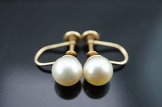 This is the perfect option for those who like cool, unique jewelry and luxury, the shine of gold and white. This earrings are well made, cute and/or elegant in design, and very desirable. The earrings are decorated with pearls. The earrings are screw back. The clasp is in good working condition. ♥ Age/Era: Circa before the 2000s. ♥ The earrings have a hallmark.14k. ♥ The earrings are about 5/8'' in diameter. The weight is 2.3g. Everyone interested in the jewelry should remember that he or she mu Classic White 14k Gold Bridal Earrings, Classic 14k Gold White Bridal Earrings, Classic Bridal Earrings In 14k White Gold, Elegant 14k Gold Clip-on Earrings For Wedding, Elegant 14k Gold Clip-on Wedding Earrings, Formal White 14k Gold Bridal Earrings, Classic 14k Gold Pearl Earrings For Wedding, Fine Jewelry White Clip-on Earrings For Wedding, White 14k Gold Bridal Earrings