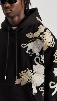 Graphic Designs For Hoodies, Oversized Hoodie Design, Black Gold Branding, Black Casual Hoodie With Embroidered Graphics, Streetwear Hoodie With Embroidered Graphics, Black Hoodie With Character Print For Streetwear, Black Designer Hoodie For Streetwear, Designed Hoodies, Black Embroidered Hoodie For Streetwear