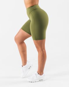 HIGHLIGHTS. 7" inseam High rise Buttery soft High sweat FIT SUGGESTION. This item runs true to Alphalete's tight fit... Brittney is 5’2”/157.5cm, wearing a size S. with 26"/66cm waist and 37"/94cm hips. MATERIALS AND WASHING DIRECTIONS. 70% Nylon, 30% Spandex. We recommend washing inside-out on a cold setting. Hang to dry DESCRIPTION Extreme high stretch meets a buttery soft hand-feel to make this fabric the perfect ten. No front seam and a double layer front panel, for added compression and com Fitted Biker Shorts With 5-inch Inseam For Gym, Fitted Bottoms For Light Exercise, Mid-thigh Length, Casual Squat Proof Athletic Shorts, Fitted Sweat Resistant Athletic Shorts For Athleisure, Fitted Athleisure Athletic Shorts, Sweat Resistant, Green Biker Shorts For Training, Green Mid-thigh Workout Biker Shorts, Breathable Biker Shorts For Workout, Sporty Green Mid-thigh Length Activewear