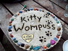 a cake made to look like it has the words kitty wompus written on it