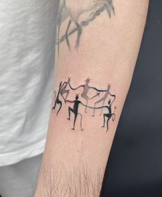 a man with a tattoo on his arm