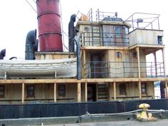 a large boat sitting on top of a dry dock