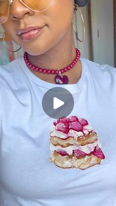 a woman wearing glasses and a necklace with food on it