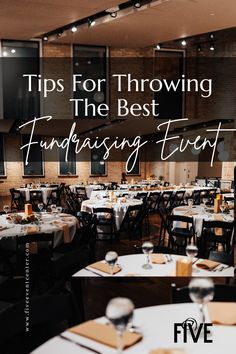 a dining room filled with tables covered in white table cloths and place settings for dinner