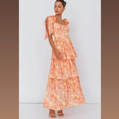 This Is A Beautiful Orange, Floral Summer Dress That Gives A Feminine Flare. It's A Perfect Dress For A Garden Party, A Wedding, Or Just A Summer Photoshoot. The Fabric Is Gorgeous And Light. Feminine Yellow Tiered Dress, Orange Tiered Dress For Day Out, Orange Tiered Dress For Brunch, Orange Feminine Maxi Dress For Brunch, Pastel Orange Dress, French Blue Wedding, Petal And Pup, Midi Party Dress, Orange Tea